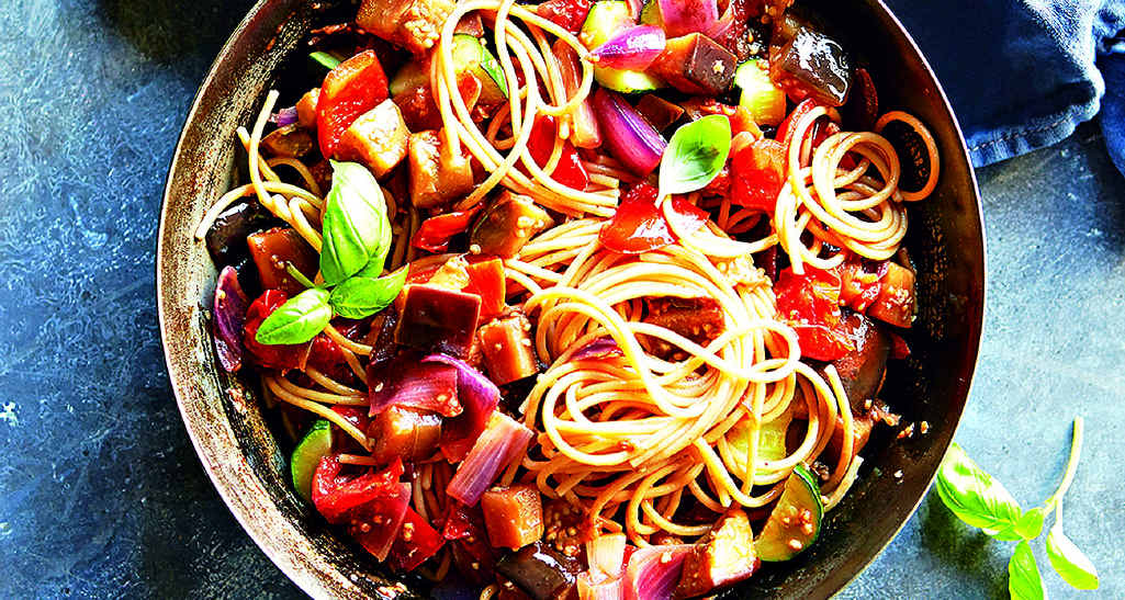 Serve pasta and ratatouille with basil scattered over the top. Serve pasta and ratatouille with basil scattered over the top.